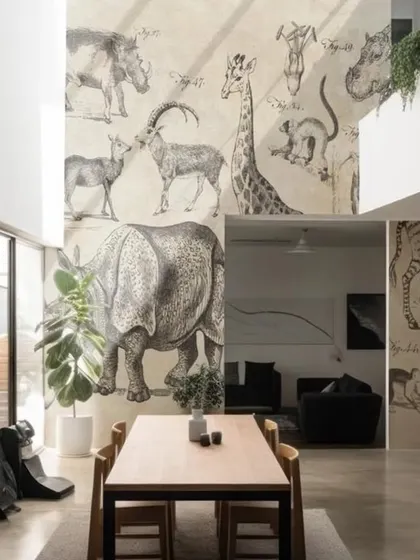This unique wallpaper features vintage-style sketches of various animals, like a rhino, giraffe, and antelope. It's a sophisticated and educational design, ideal for a study, library, or a double-height feature wall.