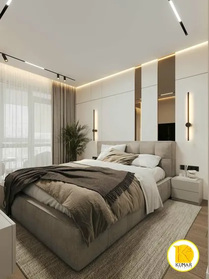 A sophisticated bedroom with a neutral color palette, track lighting, and vertical mirror panels on the headboard wall.