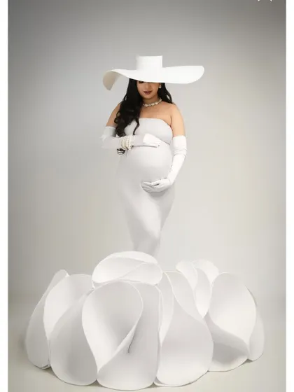 A full-length portrait of the white flower gown, capturing its architectural beauty and the serene elegance of the mother-to-be. This is a true fine-art maternity look.