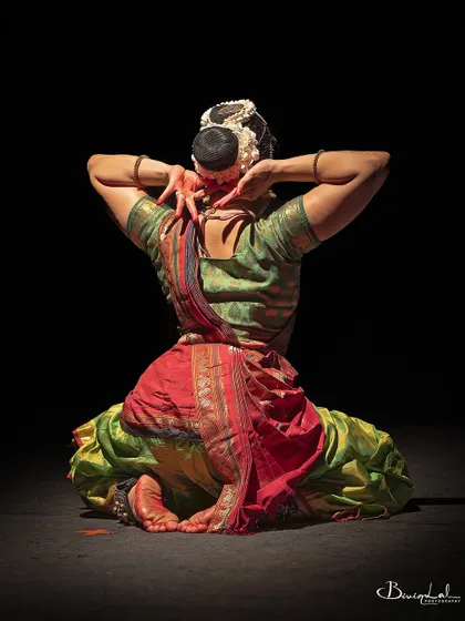 A view from the back, showcasing the intricate details of the costume and the powerful lines of the body.