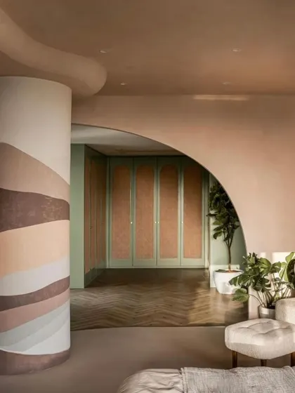 A view from the master bedroom into the walk-in closet, showcasing the use of color and texture, as featured by FOAID.