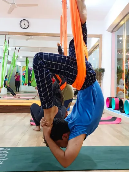 A deep, supported inversion in the aerial hammock, perfect for advanced practitioners looking to explore new variations.