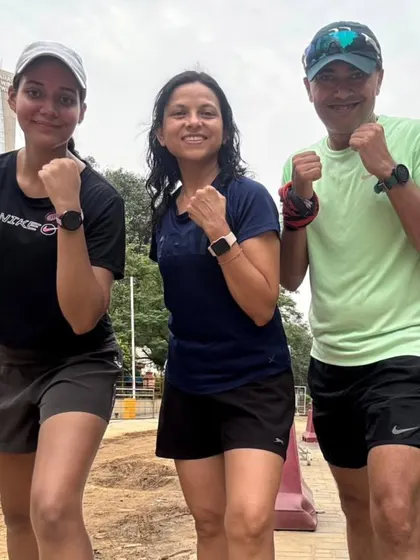 Three of our women warriors, watches synced, ready to track their progress. We are a data-driven and goal-oriented community.