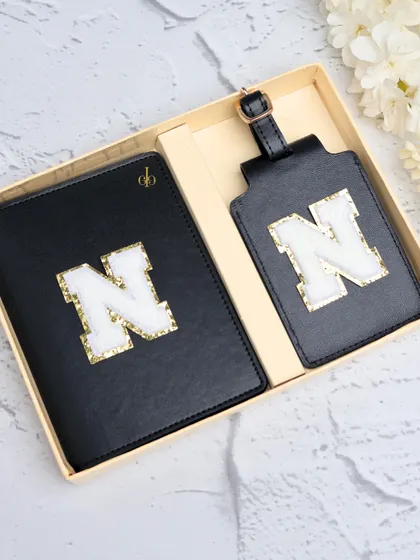 Travel, matched to perfection. This personalized passport cover and luggage tag combo in classic black with a chenille initial is available in over 12 shades to suit your style.