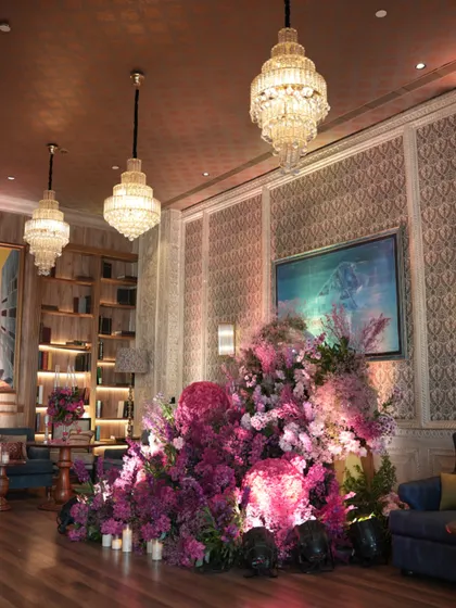 Inside the lounge, the pink floral fantasy continues. I created large, sculptural arrangements that feel like they are growing out of the floor, blending seamlessly with the venue's chic interiors while making a bold, beautiful statement.