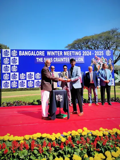 The Chairman, Mr. R. Manjunath Ramesh, presents The Sans Craintes Million trophy.