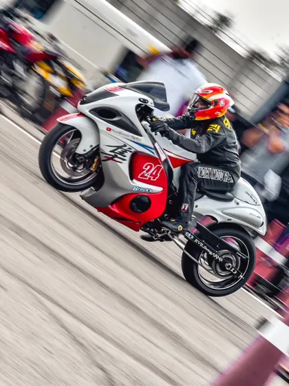 A Suzuki Hayabusa, the legendary "Busa," performs a power wheelie at launch. This iconic superbike is always a crowd-pleaser and a formidable competitor on the drag strip.