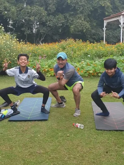 The coach with two of our youngest runners, getting in some core work. We start them young.