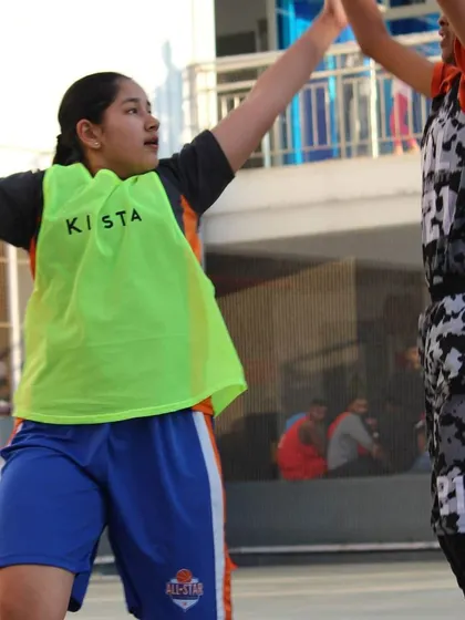 Playing tough defense during a girls' basketball game. We teach our players the importance of hard work on both ends of the floor, building the confidence that comes from being fully prepared.