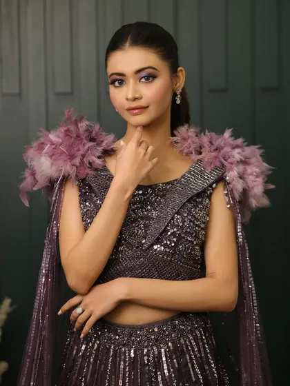 This look is for the client who isn't afraid to make a statement. The combination of a bold, colorful eye and a high-fashion outfit is perfect for a themed party or a dramatic sangeet.