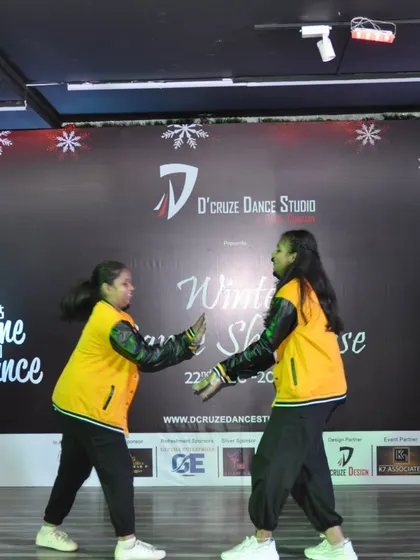 A moment of interaction between the two dancers in their showcase performance.