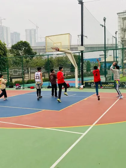 A player takes a jump shot from the wing.