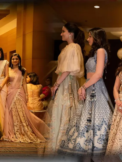 Guests dressed in their finest, enjoying the wedding festivities. I also manage guest hospitality to ensure everyone feels comfortable and well-cared for.