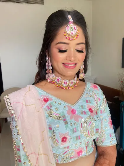 A close-up of the soft pink eye makeup, which brightens her entire face.