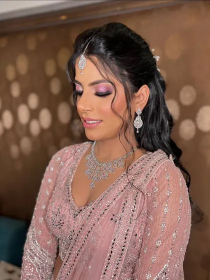 A serene shot of Garima, with her eyes closed, showcasing the beautiful blend of the pink eyeshadow.