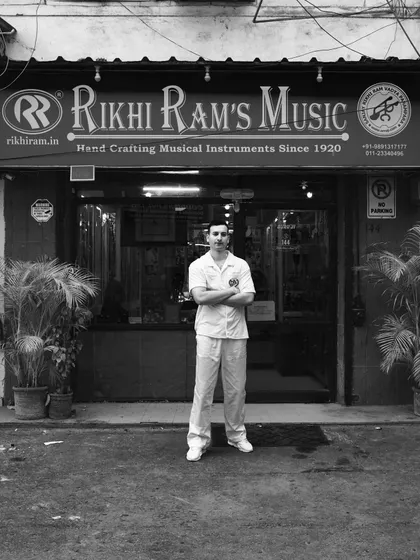 Standing outside my family's store, Rikhi Ram's Music, in Gole Market, Delhi. This is where our family's legacy of hand-crafting musical instruments since 1920 lives on.