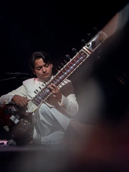 Lost in the music during a live show. This close-up captures the focus and passion that goes into every note I play, whether it's a solo piece or a full-band arrangement.