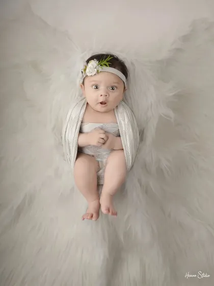 Sometimes, the most magical moments happen when they are wide awake. I love capturing those curious, expressive faces, showing the budding personality of your little one.