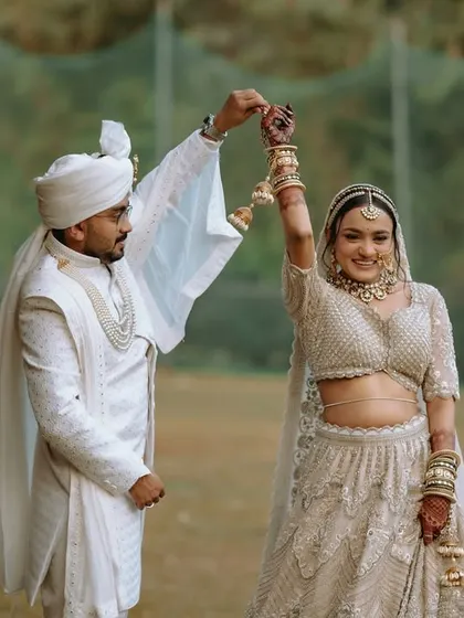 A playful and happy moment as the couple dances together after their wedding ceremony.