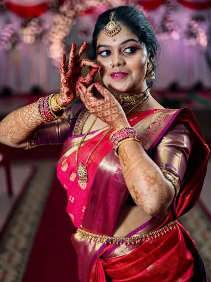 A playful and candid portrait of the bride. Her dance-like pose and happy expression show her personality and the joy of the wedding day.