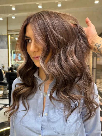 A close-up of the cool ash brown balayage, showing the delicate placement of highlights around the face and through the lengths of the hair.