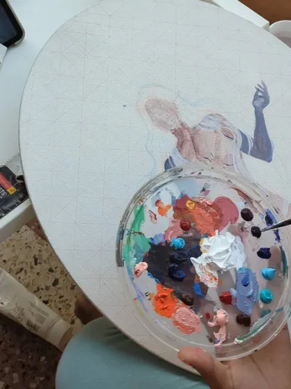 Sometimes the best studio is the one with a fresh breeze. Here I am working on a canvas painting in my balcony, with my paint palette ready to go. The natural light is perfect for mixing accurate colors.