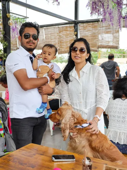 A family portrait at our brunch event, with their cocker spaniel. It's a perfect weekend outing for the entire family.