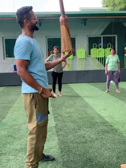 An instructor explains the nuances of a movement to the group. Education is a key part of my coaching, helping you understand the 'why' behind every exercise.