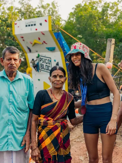 A bronze medalist from the women's competition with the owners of the farm. It's a wonderful connection between the athletes and the people who make the event possible.