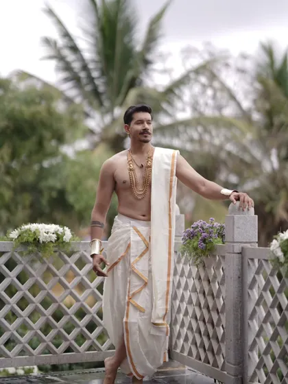 A duplicate of image 5, showcasing the timeless appeal of traditional groom's attire and jewellery for a South Indian wedding.