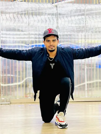Striking a pose in the studio. It's all about confidence and owning your space.