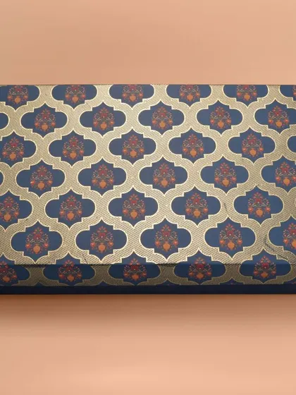 A long rectangular box with a royal blue and gold traditional Indian pattern. We ensure patterns are sharp and colors are true to life.