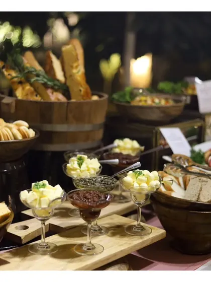 A display of our bread service, featuring an assortment of freshly baked breads and flavoured butters, a testament to the skill of our in-house bakery team.