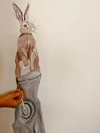The process of painting a curious rabbit for a child's room mural. I enjoy creating these friendly characters that add a storybook feel to the space.