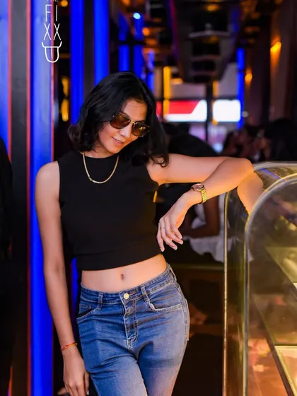 A cool, relaxed pose from a guest at The Fixx. It's not just about high-energy dancing, but also about chilling and soaking in the vibe.