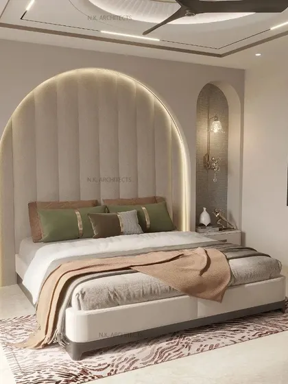 We love using arches to create a soft, warm vibe. This bedroom features a large, upholstered arch as a headboard, with matching arched niches on the side. The subtle colors and warm lighting make it a very classy and inviting space.