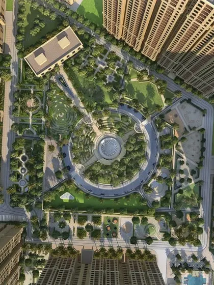 A top-down view of Casagrand Sun City reveals the geometric precision of the Roman-inspired landscape design, with a grand central plaza and manicured gardens creating a formal, organized community layout.