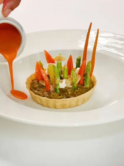 Our saag tart is a harmony of flavours, with tossed vegetables, roasted almonds, and a rich makhani sauce. It brings tradition and creativity together on one plate.