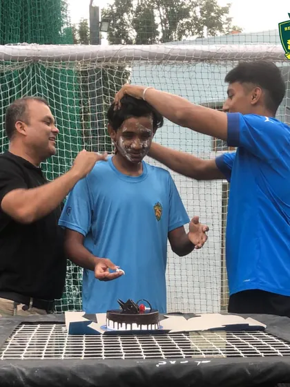 The traditional cake-smashing fun during Hari's birthday celebration at the academy.