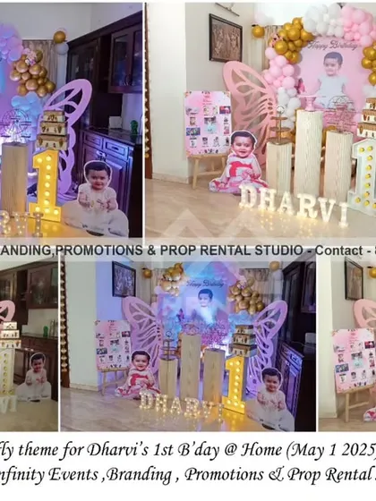 Never hide your wings! This butterfly theme for a first birthday at home features a beautiful circular backdrop with large butterfly wings and a pink and gold balloon garland. The personalized photo of the birthday girl adds a lovely touch.