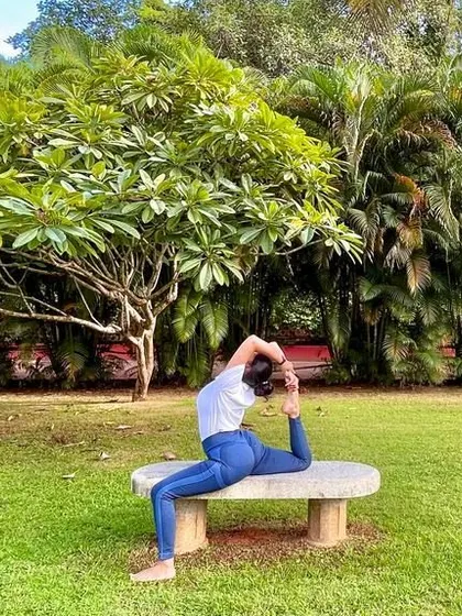 Using a bench for a supported Eka Pada Rajakapotasana. Yoga is not a work-out, it is a work-in. It's about opening our hearts and focusing our awareness.