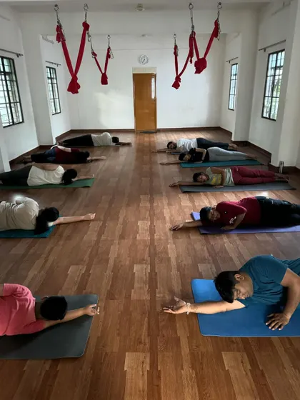 A 6 am relaxing Yin Yoga session. Students hold a side-lying pose to gently open the body and calm the mind.