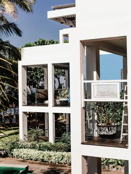 Plant decor can be integrated with your home's architecture. Here, plants are placed on multiple levels of a modern building, making the greenery a core part of the design.