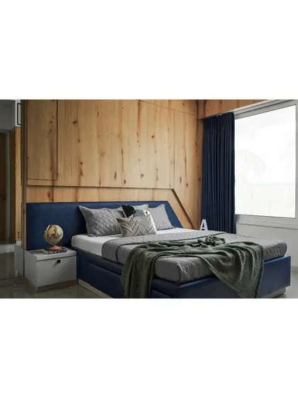 A side view of the bed in the teenager's room, highlighting the simple yet stylish design.