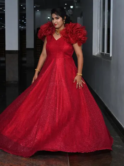 Another angle of the dramatic red gown, perfect for making a grand entrance.