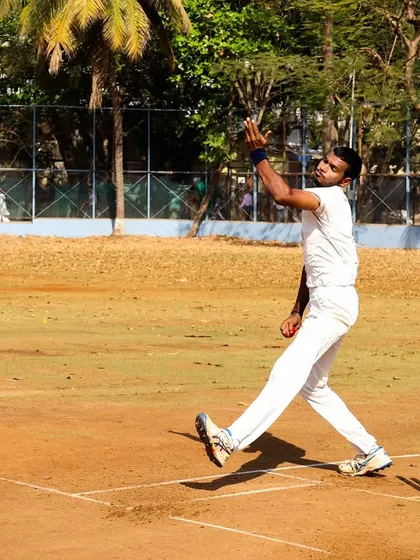 A bowler in full flow during a practice match. These sessions are crucial for building rhythm and confidence.