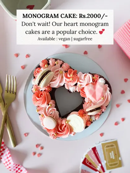 Our heart monogram cakes are a popular choice for a reason. This one, with its beautiful piping and macarons, is available in vegan and sugar-free options.