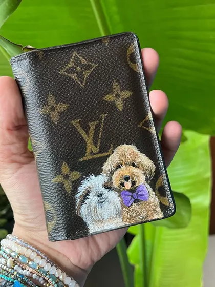 A different angle of the custom LV card holder with the two dog portraits.