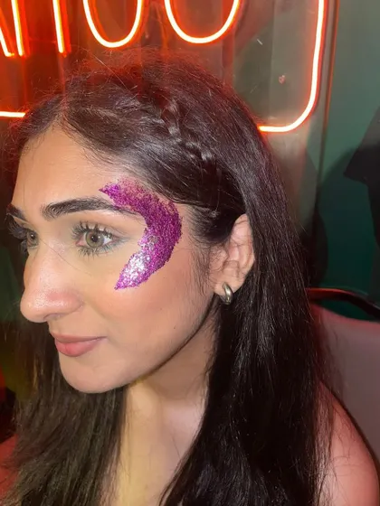 A vibrant magenta glitter crescent design. The bold color makes a huge impact and is perfect for standing out in a crowd.