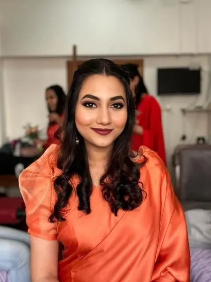 Subtle yet elegant for this bridesmaid. A bold lip and clean eye makeup create a sophisticated look that's perfect for a Catholic wedding ceremony.